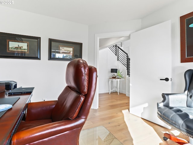 home office with light wood-style flooring