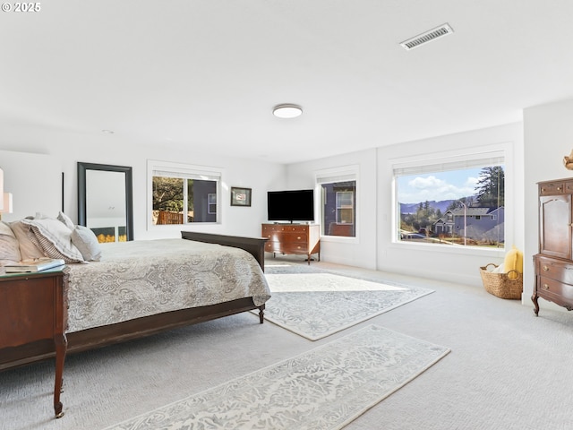 bedroom with carpet and visible vents