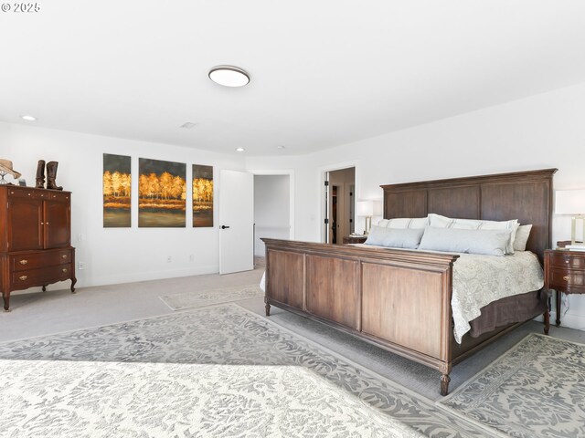 bedroom featuring light carpet