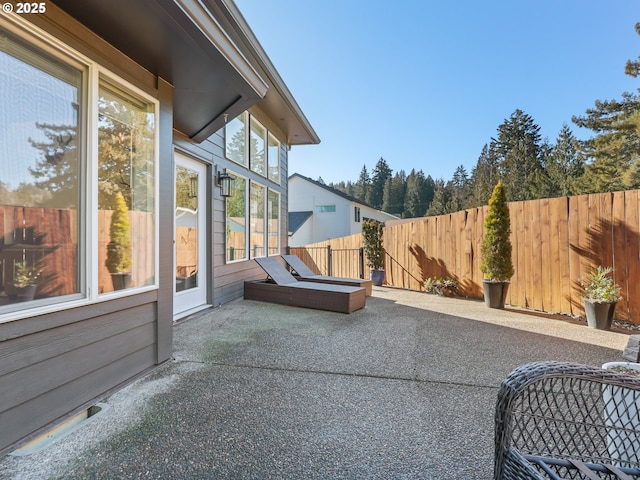 view of patio featuring fence