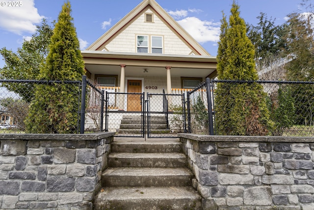 4903 SE Haig St, Portland, OR 97206 - view of front facade featuring a gate, a porch, and a fenced front yard