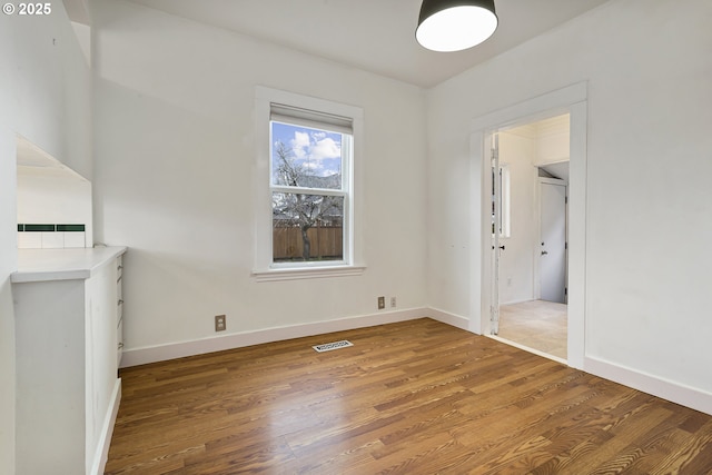 4903 SE Haig St, Portland, OR 97206 - unfurnished dining area featuring wood finished floors and baseboards