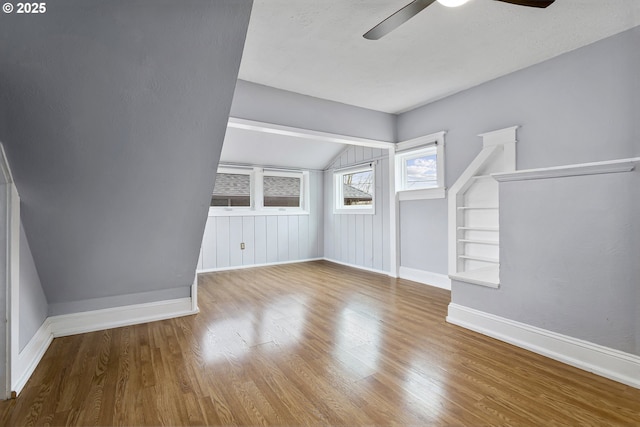4903 SE Haig St, Portland, OR 97206 - spare room featuring vaulted ceiling, ceiling fan, and wood finished floors