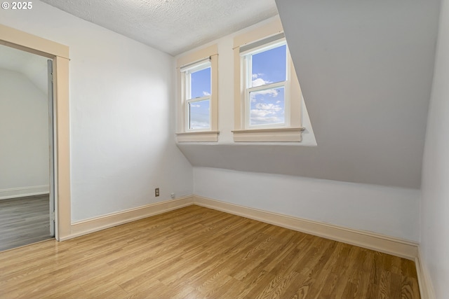4903 SE Haig St, Portland, OR 97206 - additional living space with light wood-type flooring and a textured ceiling