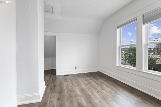4903 SE Haig St, Portland, OR 97206 - bonus room featuring lofted ceiling, wood finished floors, and attic access