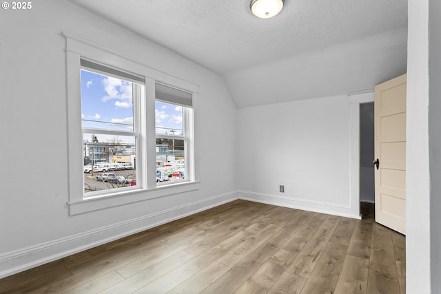 4903 SE Haig St, Portland, OR 97206 - bonus room with vaulted ceiling, a textured ceiling, and wood finished floors
