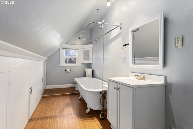 4903 SE Haig St, Portland, OR 97206 - bathroom featuring vanity, a freestanding tub, lofted ceiling, wood finished floors, and a shower