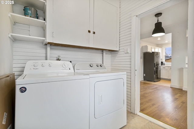 4903 SE Haig St, Portland, OR 97206 - laundry room featuring cabinet space and washing machine and dryer