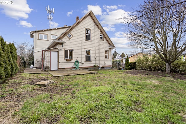 4903 SE Haig St, Portland, OR 97206 - rear view of house with a patio and a chimney