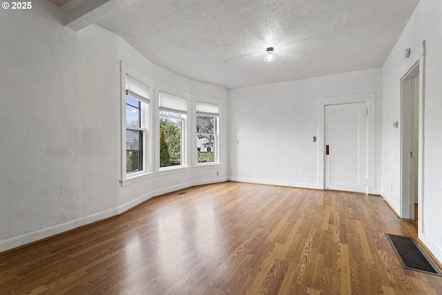 4903 SE Haig St, Portland, OR 97206 - unfurnished room with wood finished floors and a textured ceiling