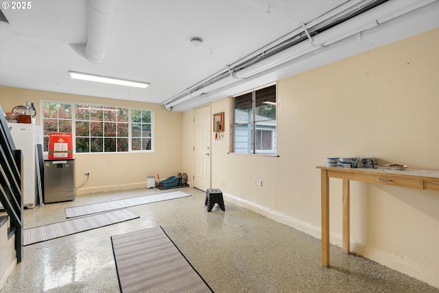 workout room with baseboards