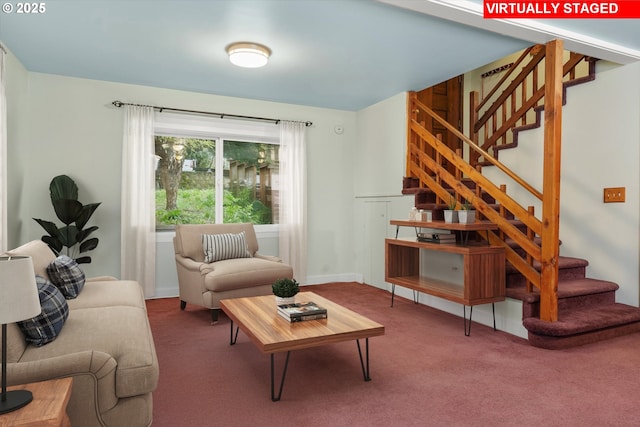 living area with carpet, stairway, and baseboards