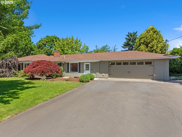 1675 NW 1st St, Gresham, OR 97030 - single story home with asphalt driveway, a garage, a front yard, and a chimney