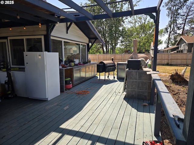 160 NW Logan Dr, Hermiston, OR 97838 - wooden terrace with a fenced backyard, a grill, and a pergola