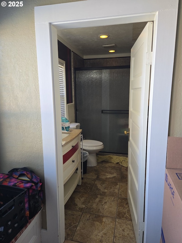160 NW Logan Dr, Hermiston, OR 97838 - full bath featuring vanity, a shower stall, toilet, and stone finish floors