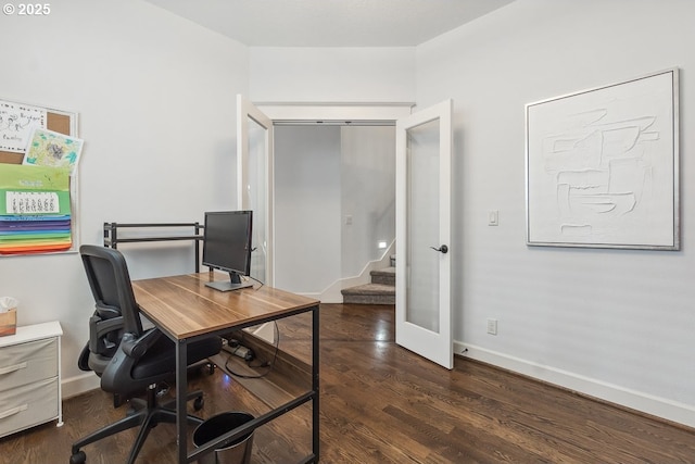 office area featuring dark wood-type flooring and baseboards