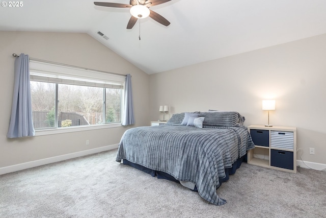 bedroom featuring visible vents, baseboards, carpet flooring, and vaulted ceiling