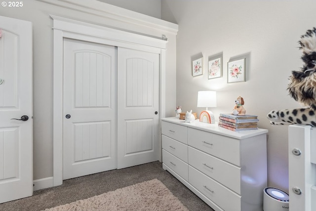 bedroom with carpet and a closet