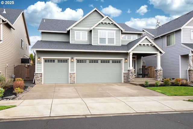 craftsman-style house featuring driveway, a porch, a shingled roof, a garage, and stone siding