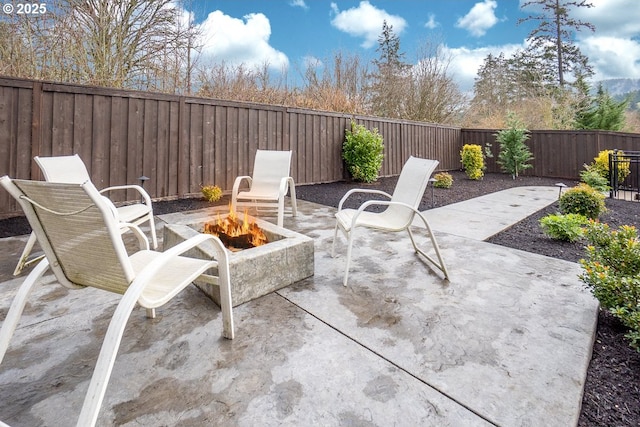 view of patio / terrace featuring a fire pit and a fenced backyard