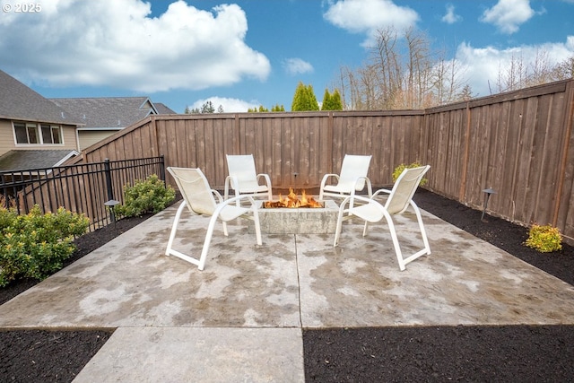 view of patio / terrace featuring a fenced backyard and an outdoor fire pit