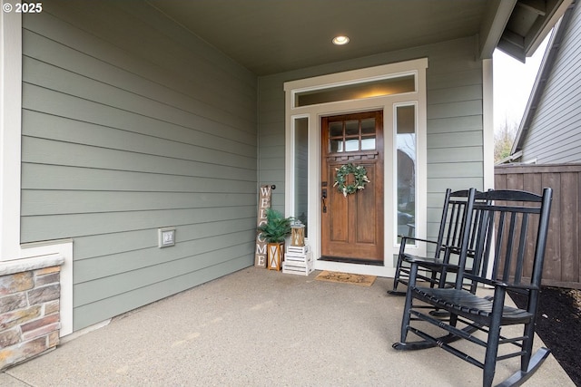 property entrance featuring a porch