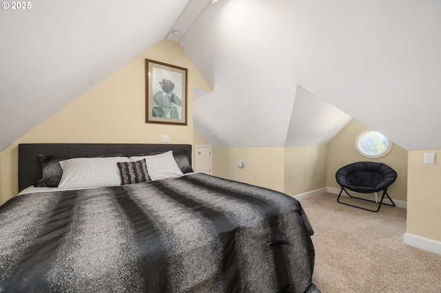 bedroom featuring vaulted ceiling and light carpet