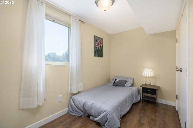 bedroom featuring dark wood-type flooring