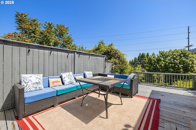 wooden terrace with outdoor lounge area