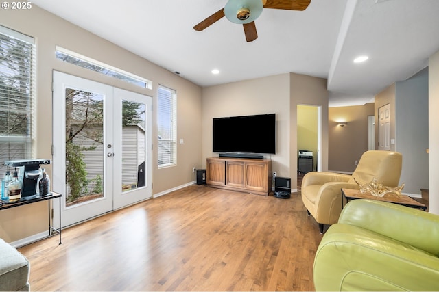 living room featuring light wood-type flooring, ceiling fan, french doors, and recessed lighting