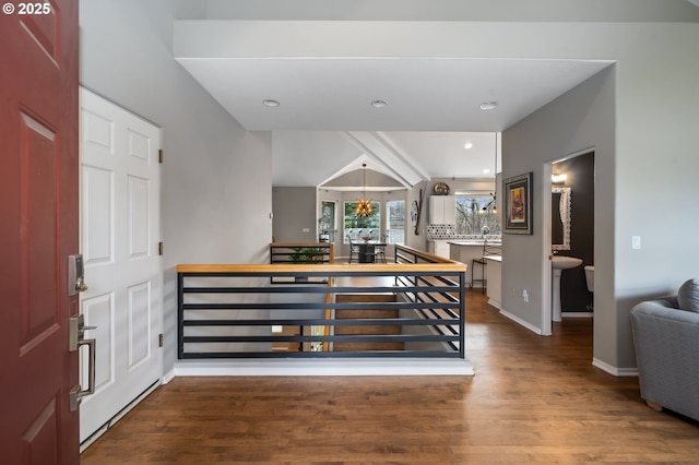 foyer entrance with recessed lighting, wood finished floors, a chandelier, and baseboards