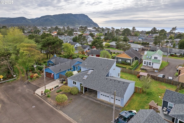 birds eye view of property featuring a mountain view and a residential view