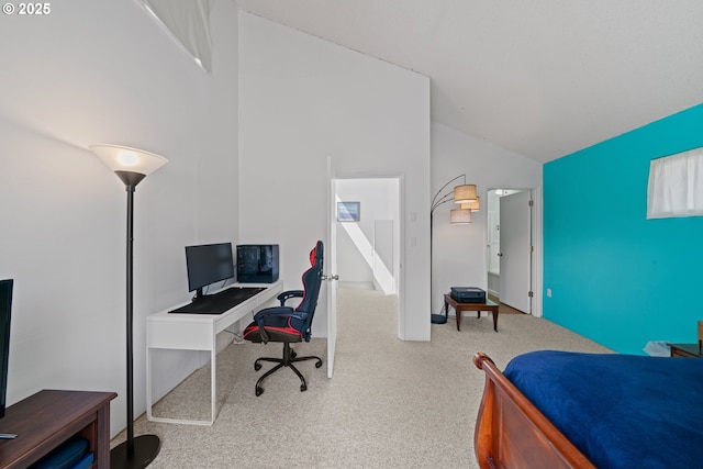 bedroom with vaulted ceiling and carpet