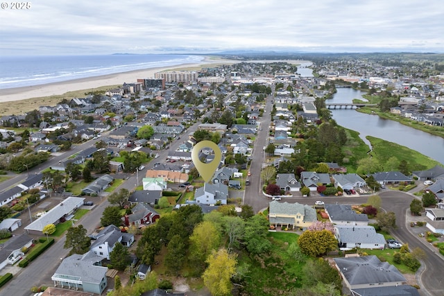 drone / aerial view with a water view and a residential view