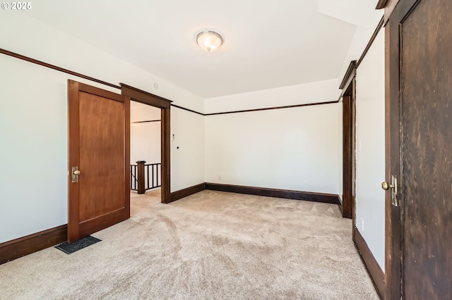 1203 SE 53rd Ave, Portland, OR 97215 - unfurnished bedroom featuring light carpet and baseboards