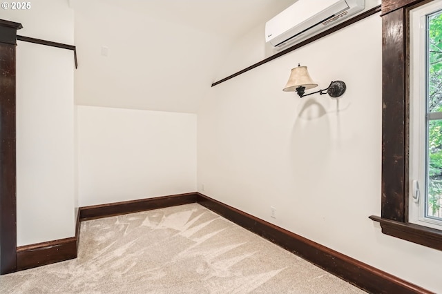1203 SE 53rd Ave, Portland, OR 97215 - walk in closet with an AC wall unit, carpet flooring, and vaulted ceiling