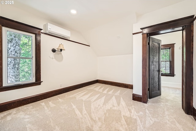 1203 SE 53rd Ave, Portland, OR 97215 - spare room with a wall mounted air conditioner, lofted ceiling, carpet floors, and recessed lighting