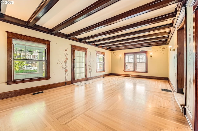 1203 SE 53rd Ave, Portland, OR 97215 - unfurnished room with beam ceiling and a wall mounted air conditioner