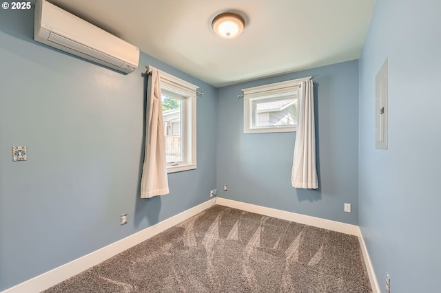 1203 SE 53rd Ave, Portland, OR 97215 - unfurnished room featuring a wall mounted air conditioner, dark colored carpet, and electric panel