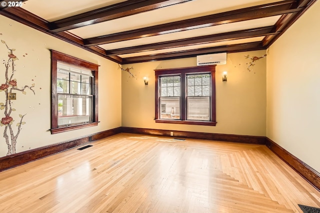 1203 SE 53rd Ave, Portland, OR 97215 - empty room featuring a wall mounted air conditioner and beam ceiling