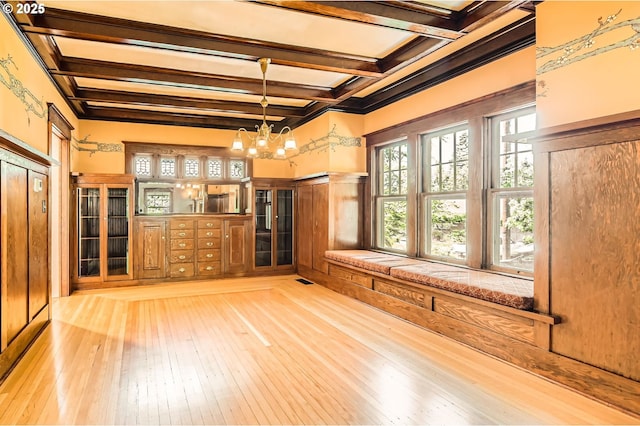 1203 SE 53rd Ave, Portland, OR 97215 - unfurnished living room featuring beam ceiling, light wood-type flooring, a chandelier, and coffered ceiling