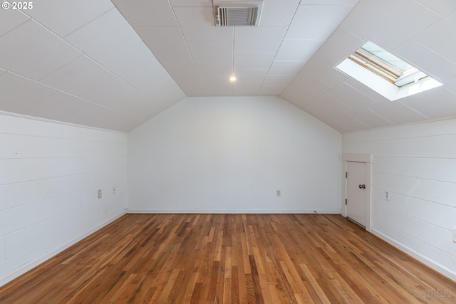 11005 SW 35th Ave, Portland, OR 97219 - additional living space featuring a skylight, vaulted ceiling, and light wood-style floors