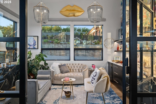 interior space featuring hardwood / wood-style flooring, plenty of natural light, and a chandelier