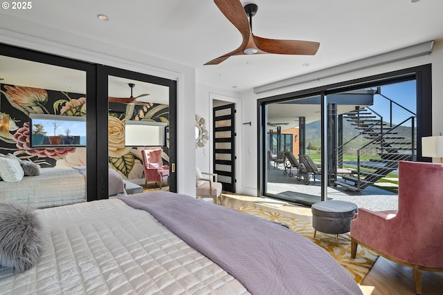 bedroom with ceiling fan, access to outside, and wood-type flooring