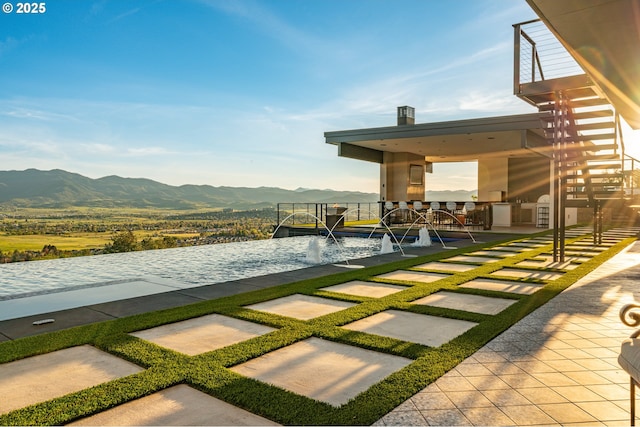 view of yard featuring area for grilling and a mountain view