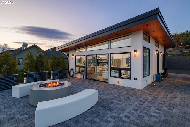 exterior space with a fire pit