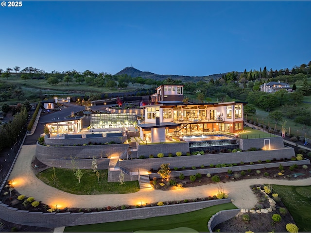 aerial view at dusk with a mountain view