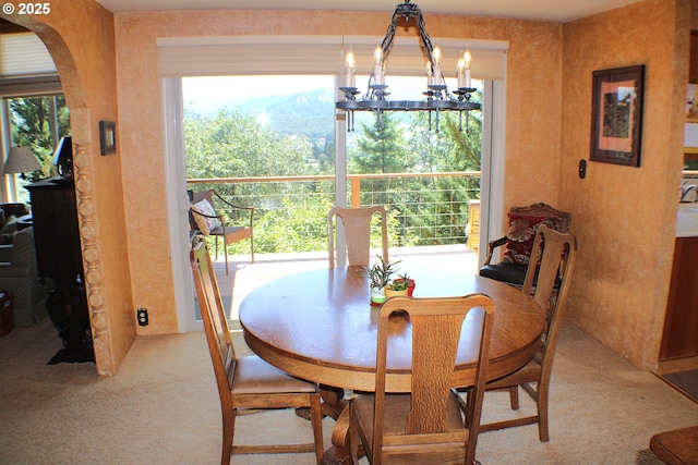 1056 NE Orchard Dr, Myrtle Creek, OR 97457 - carpeted dining area with a chandelier and arched walkways
