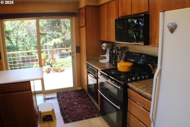 1056 NE Orchard Dr, Myrtle Creek, OR 97457 - kitchen featuring black appliances and brown cabinets