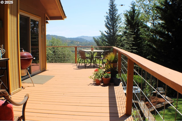 1056 NE Orchard Dr, Myrtle Creek, OR 97457 - deck featuring a mountain view, outdoor dining space, and area for grilling